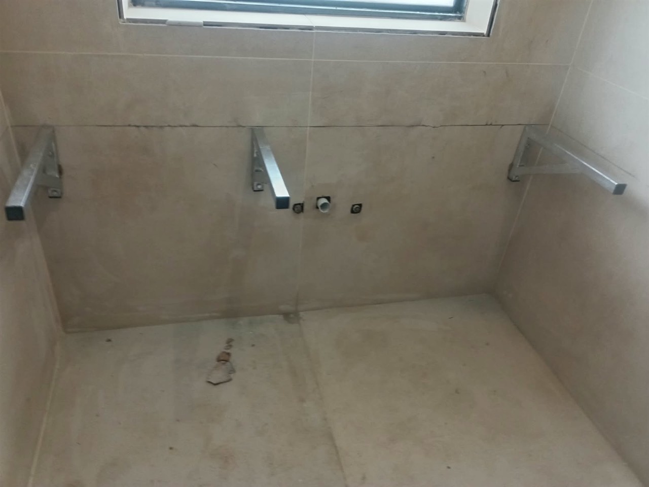 Bathroom vanity area before the stone surface installation